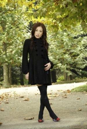 Fully clothed Japanese teen models in the park in black clothes and stockings - Japan on chickinfo.com