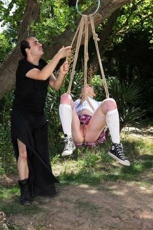 Schoolgirl Samantha Bentley finds herself suspended from ropes in the woods on chickinfo.com