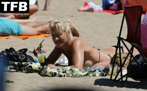 Sarah Connor Flashes Her Nude Breasts on the Beach on chickinfo.com