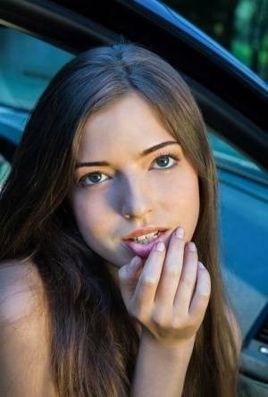 Beautiful teen girl models in the nude on passenger seat of car with door open on chickinfo.com