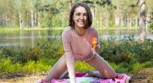 Young amateur Ava bares her hard body on a blanket near the water on chickinfo.com