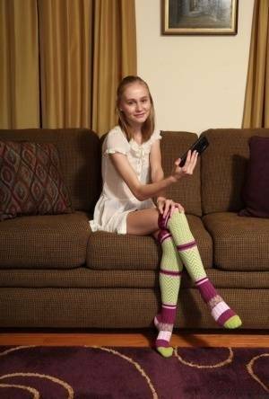 Adorable teen Alicia Williams takes a selfie before getting naked in OTK socks on chickinfo.com