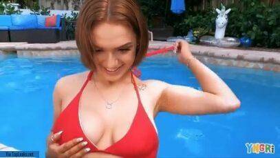 Gracie Gates coyly undoes her top in the pool on chickinfo.com